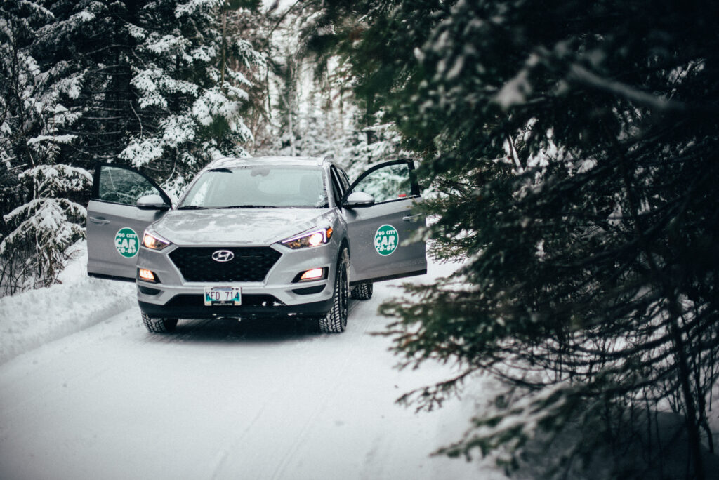 a Peg City SUV, parked on a snowy road in the winter