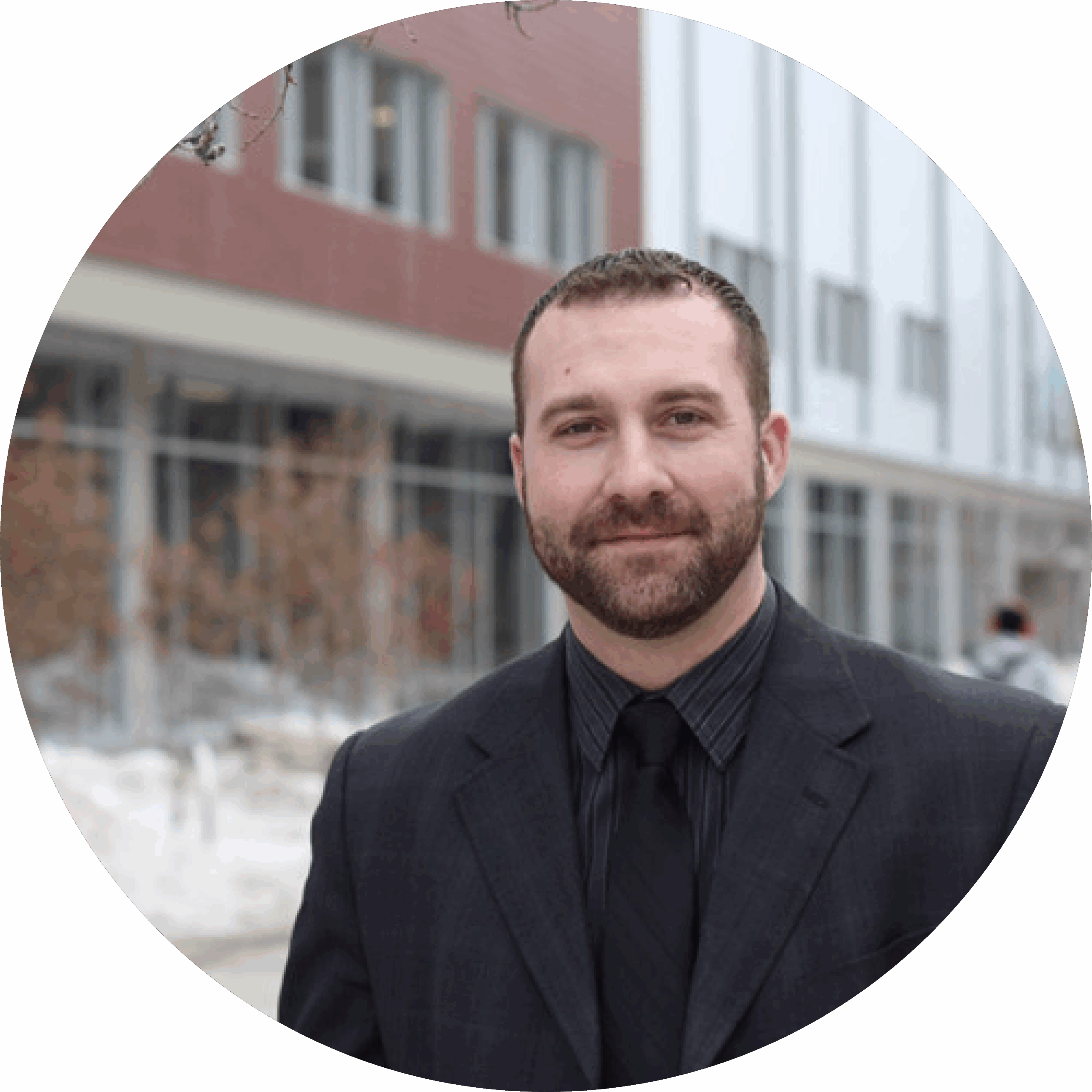 Jeremy stands in front of a new development